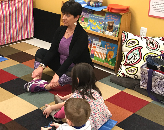 Deb Ronga of Lotus Lil teaching yoga to kids at Sunshine Nursery School.