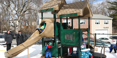 Kids playing at the playground adjacent to Sunshine Nursery School.